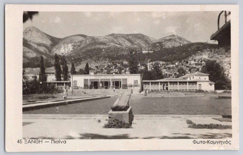 Xanthi, Greece Riverfront Colonnade with Mountain Backdrop, White Border