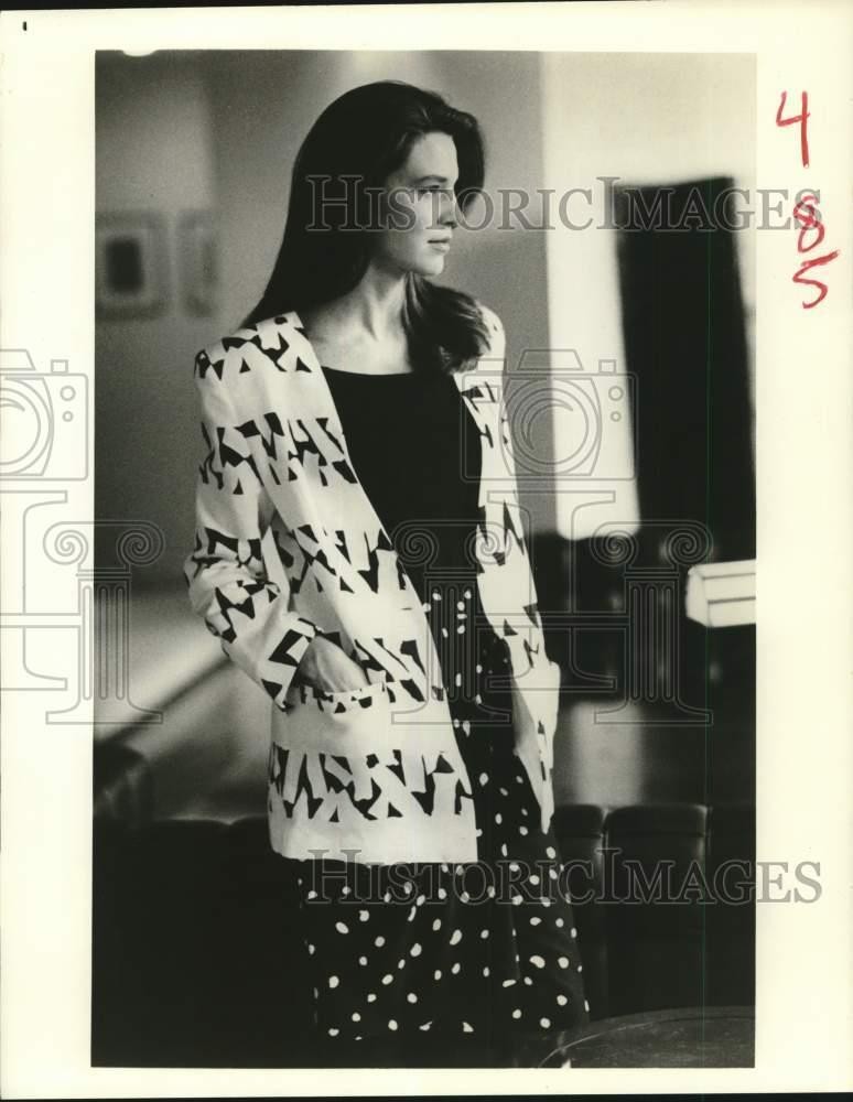 1988 Press Photo A model in dotted black dress and patterned white jacket