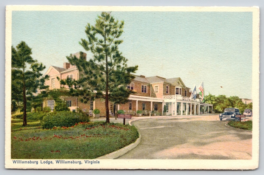Virginia~Williamsburg Lodge Bldg Exterior~US Flag~Vintage Postcard