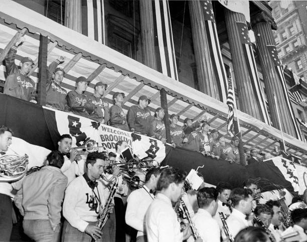 The Brooklyn Dodgers look on from above at their reception outside .. Old Photo
