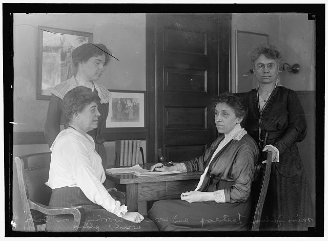 Lathrop, Julia. Head Of Children's Bureau, Labor Dept. With Assistants; 'Baby