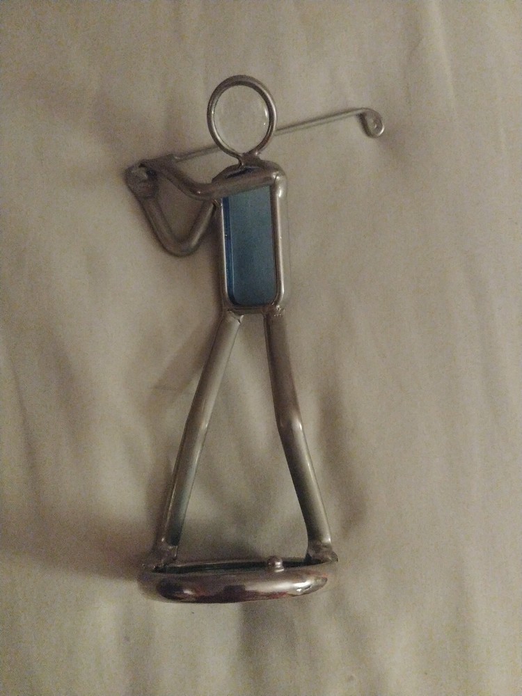 Abstract metal and colored glass golfing figure on stand-image