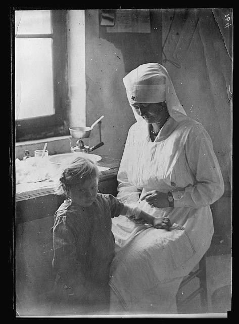 Photo:Nurse with Child 1910s Interior Portrait Black and White Photo