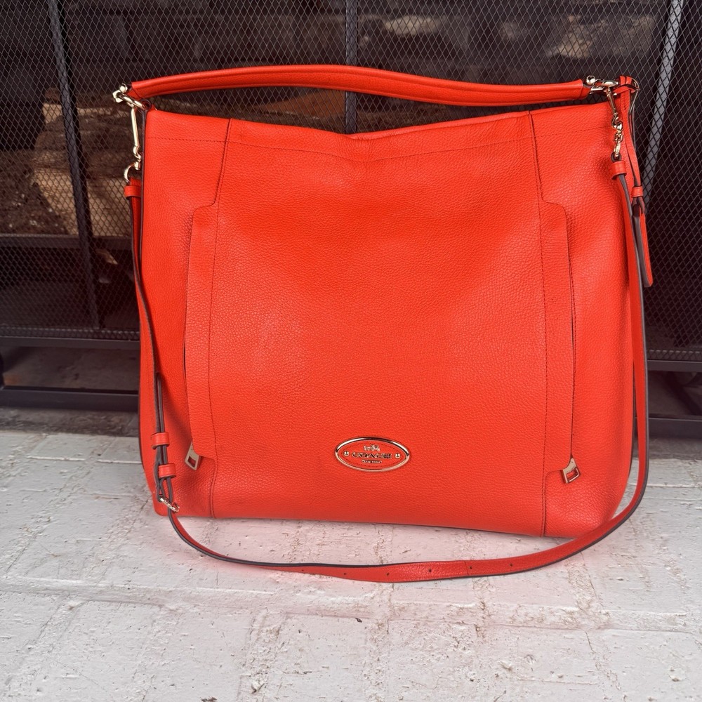 COACH Light Coral Leather Hobo Bag with Adjustable Strap and Front Zip Pockets