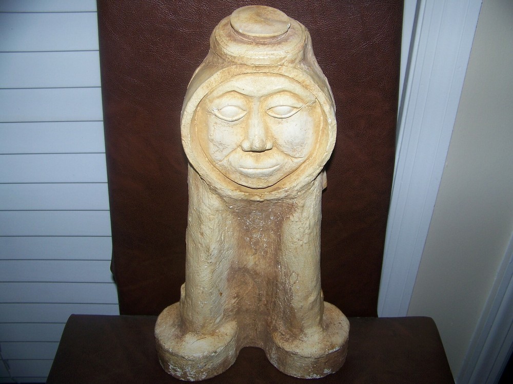 Abstract Cement Sculpture of Rider with Braided Hair-image