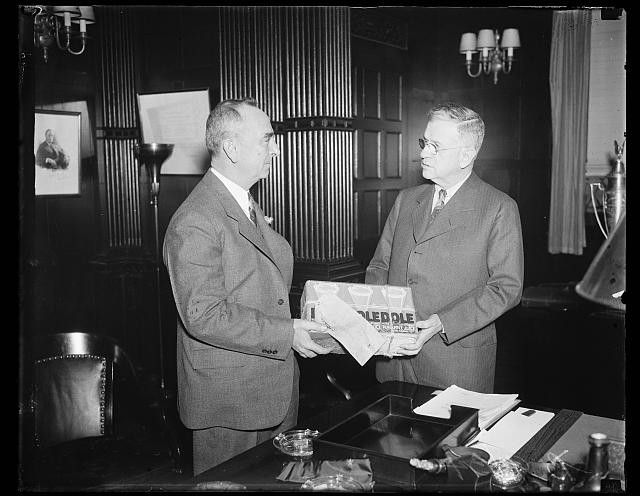 Photo:Harold Ickes, right; with case of Dole pineapple juice
