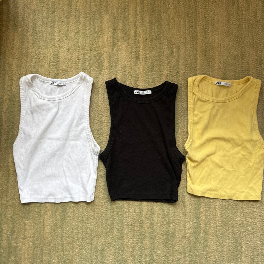 White, black, and yellow tank tops