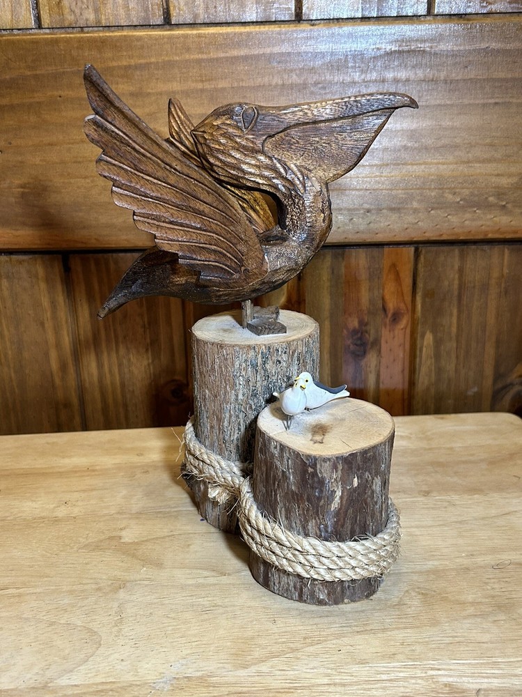 Peligan with 2 seagulls on pedestal with rope hand carved wooden 10 1/2 T X 9w