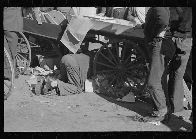 1930s Street Vendor Cart Men Under Wagon Wheels Black and White Photo