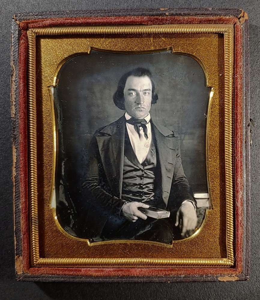 1/6 plate daguerreotype of serious man with book - in half leathette case