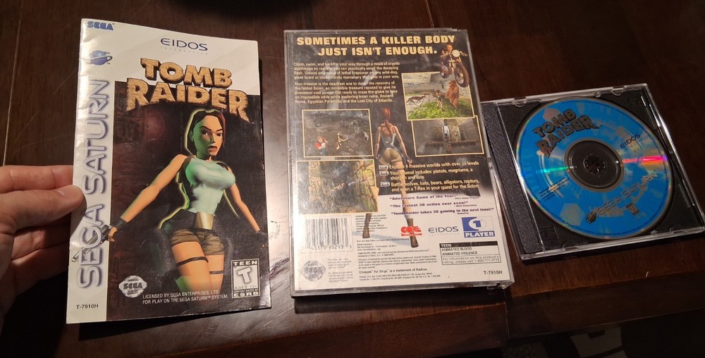 Tomb Raider (Sega Saturn). NTSC-U/C. Tested w/ Manual. Case not fully intact.