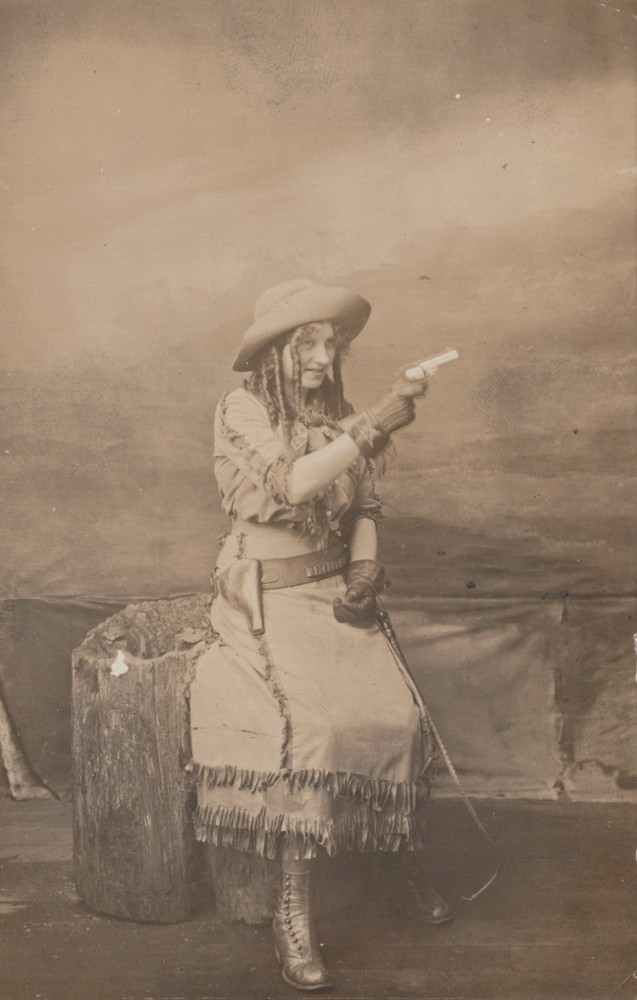 Cowgirl /  Woman in Western wear holding gun / pistol ~ Seattle WA Washington