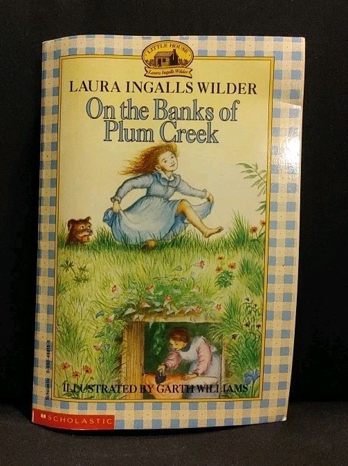 On the Banks of Plum Creek by Laura Ingalls Wilder Softcover Book Very Good