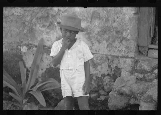Photo:Young Boy Hat Stone Wall 1930s 1940s Black and White Portrait
