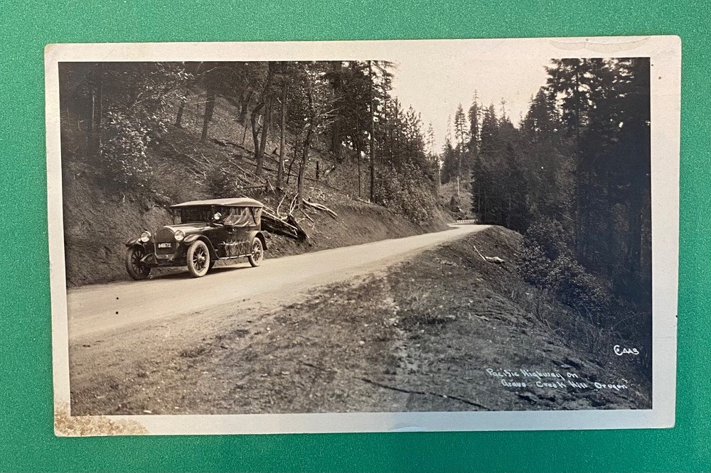 c1920’s GRANTS PASS GRAVE CREEK HILL PACIFIC HWY OREGON PACKARD ? RPPC POSTCARD