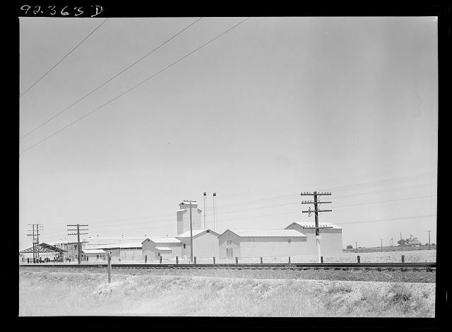Photo:1930s Industrial Plant Railroad Tracks Utility Poles Smoke Stacks