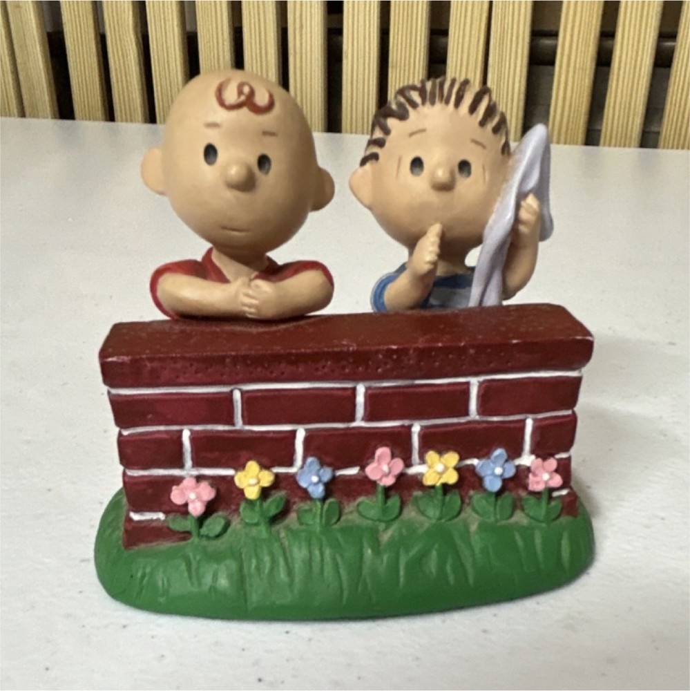 This vintage collectible is a 1994 Danbury Mint figurine featuring Charlie