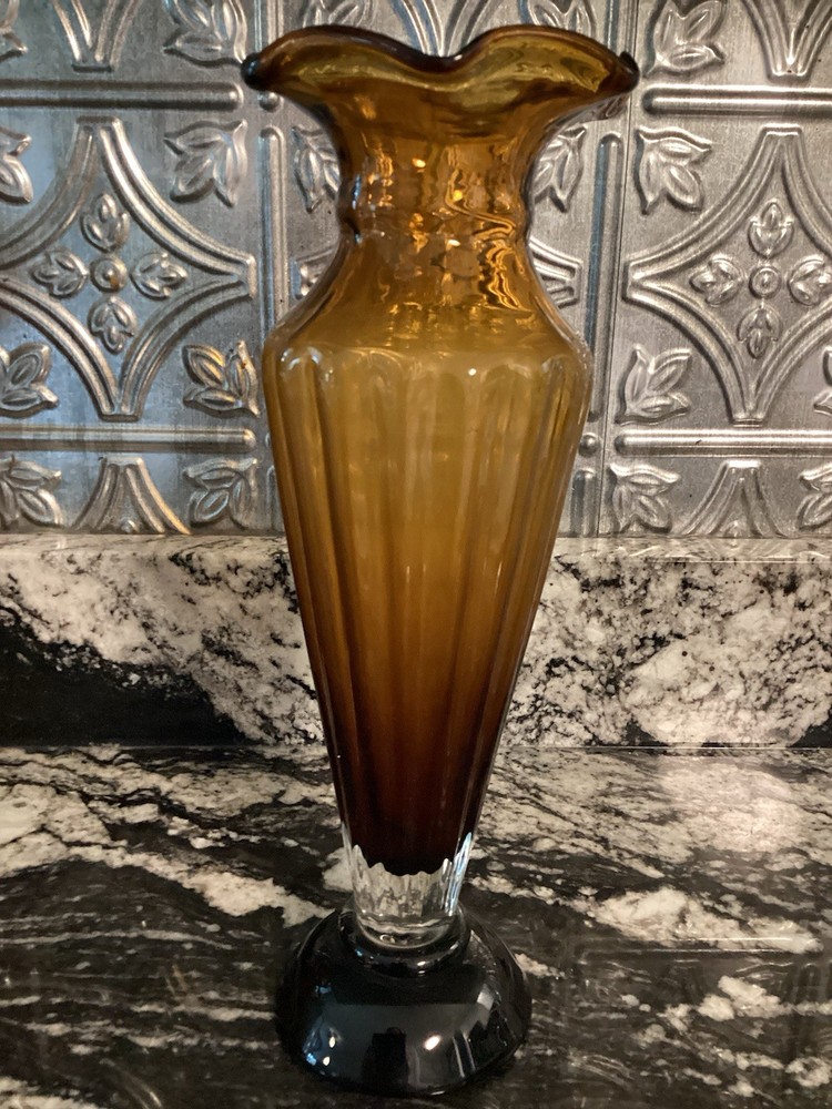 vintage amber art glass footed vase with a ribbed body and a ruffled rim