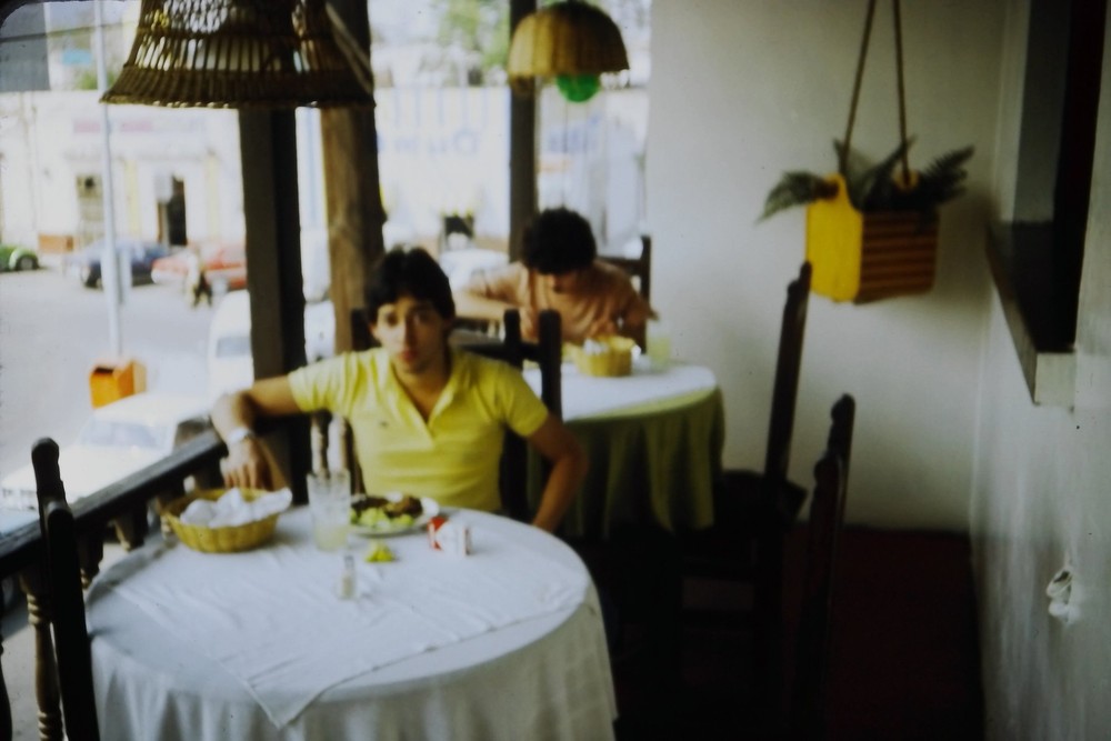 c1980's 35mm Slide Restaurant Interior Young Man Dining Street View Window Car