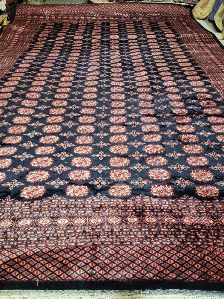 Circa 1950s Bokhara-style rug, 9’ x 12’, hand-knotted wool, gul pattern
