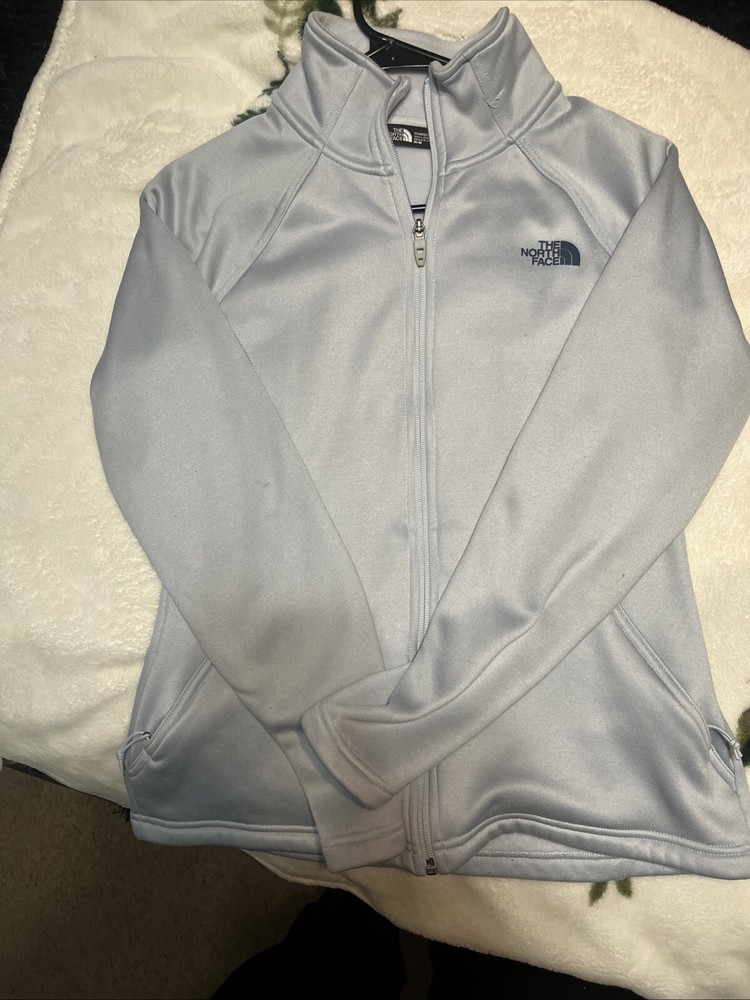 Women's medium blue North Face puffer jacket for cold weather