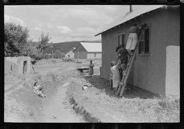 Chamisal New Mexico 1940 Plastering Adobe House Washing by Irrigation Ditch