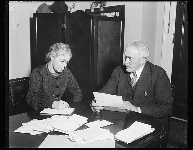 Photo:1934 1935 Office Meeting Woman Man Papers Desk Black and White Photo
