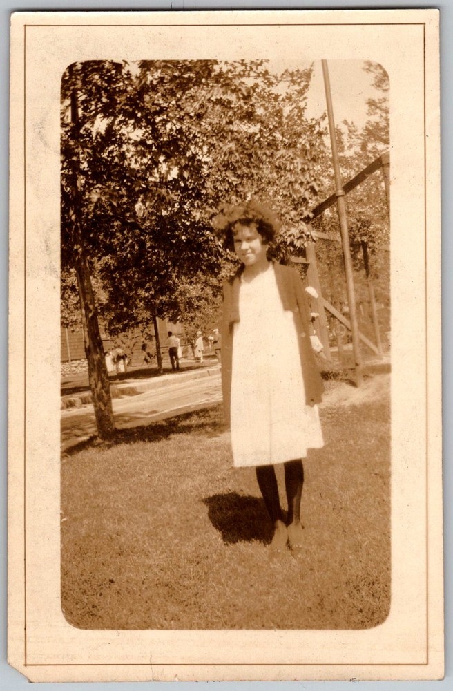 Vtg B&W Snapshot Young Girl in White Dress And Coat Outdoors 1920s