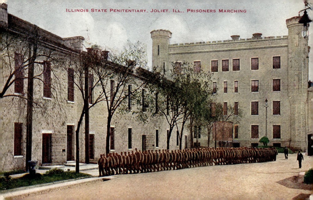 C1910 Illinois State Penitentiary Joliet IL Prisoners Marching Litho Postcard