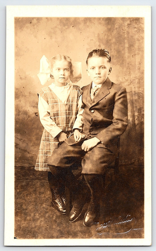 Portrait Of A Young Girl In Dress And Boy In Suit Vintage Real Photo Postcard