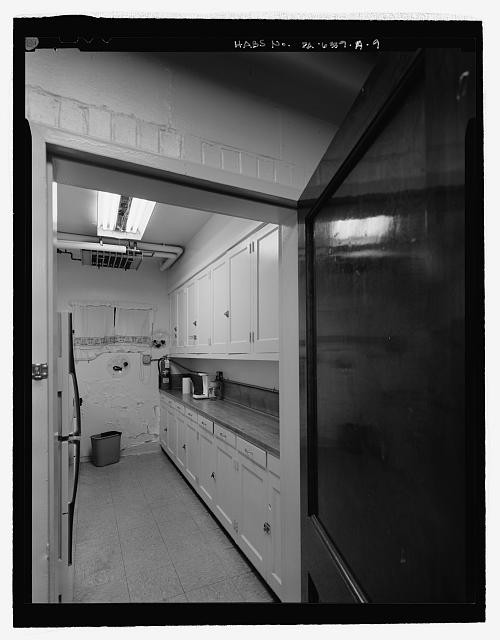 9. Kitchen in basement of management building, looking east. - Bedford