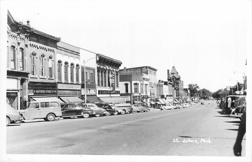 1950s St. Johns Michigan Street Scene automobiles RPPC Postcard 25-9345