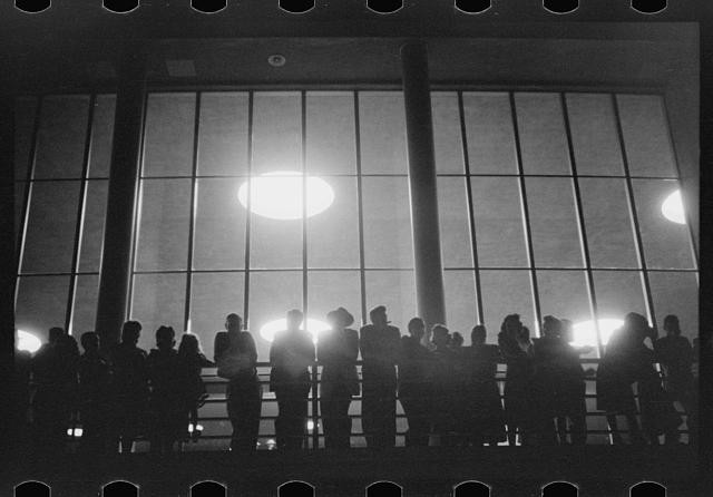 Photo:1930s Silhouetted Crowd at Large Window Interior Night Scene