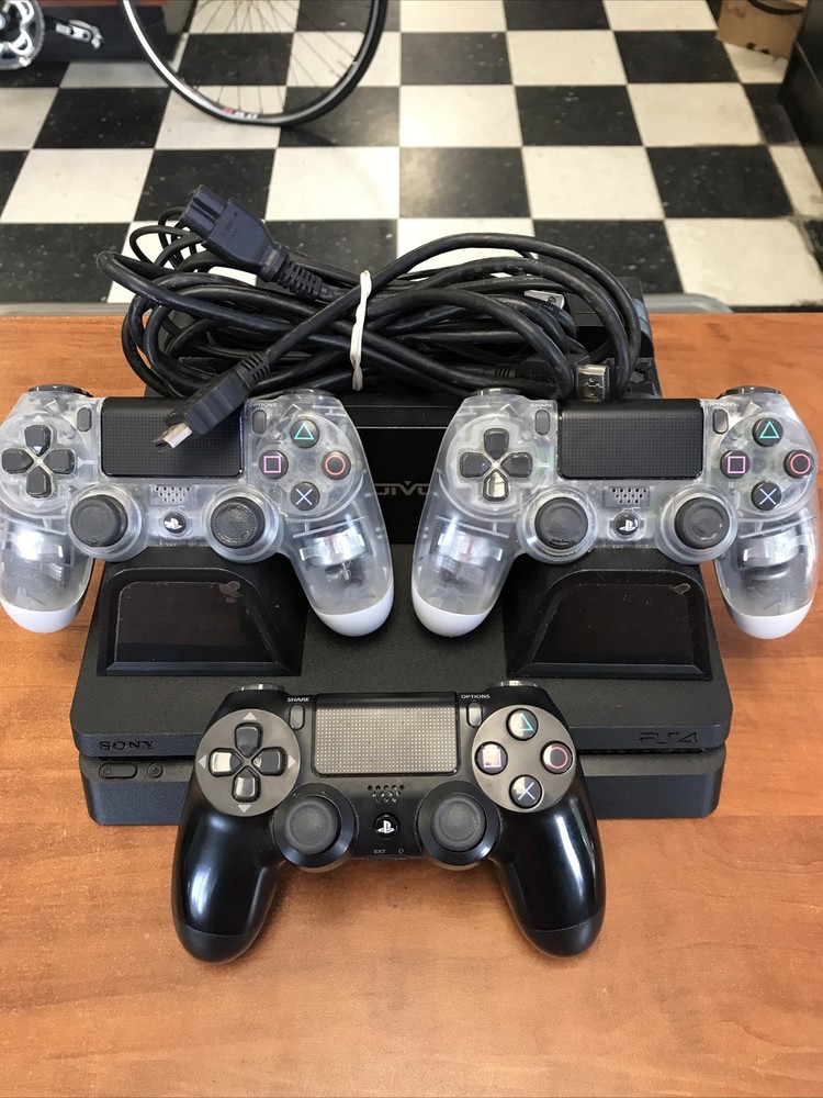 Sony PlayStation 4 Slim 1TB Console - Jet BlackComes With 3 Controllers And A Charging Station