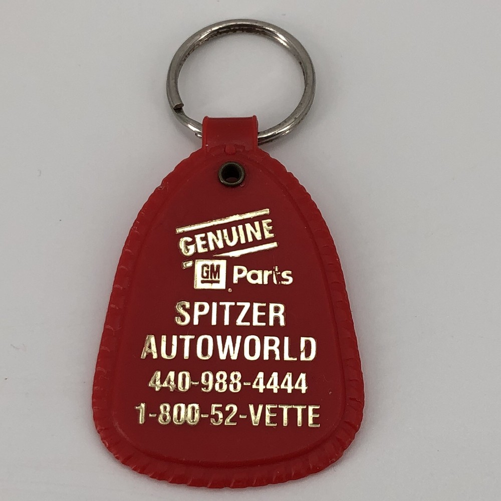 Red Spitzer Autoworld GM Car Dealer Keychain Amherst OH Vintage Plastic Promo