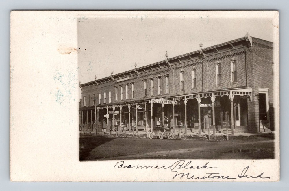 Mentone Indiana, RPPC: Banner Block Big Drug Store Main Street Vintage Postcard