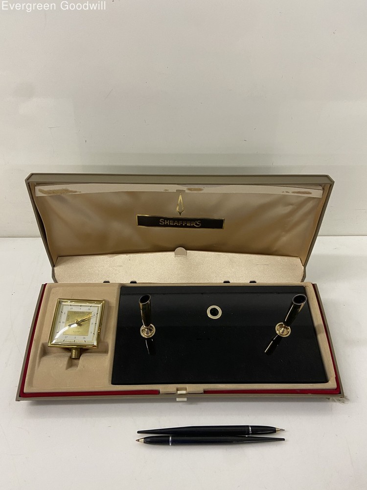 vintage Sheaffer desk set featuring a clock and two pens,