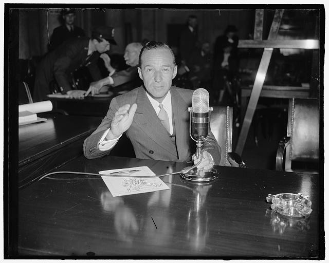 Photo:1940s Man at Hearing Witness Testifying Before Microphone Jury Room