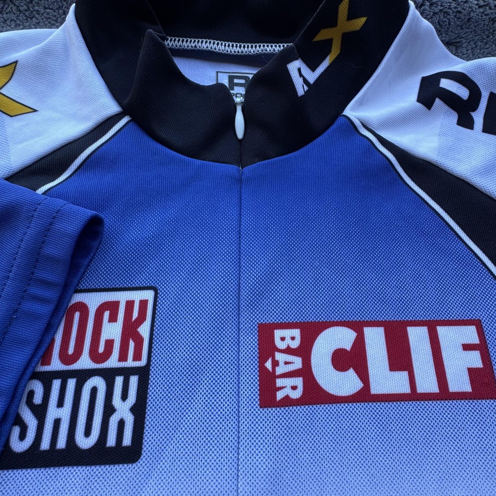 RLX Polo Sport Cycling Jersey Mens Medium Blue Black Pockets Made USA Shimano