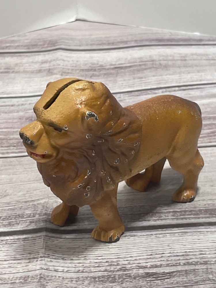 LION CAST IRON COIN BANK VINTAGE