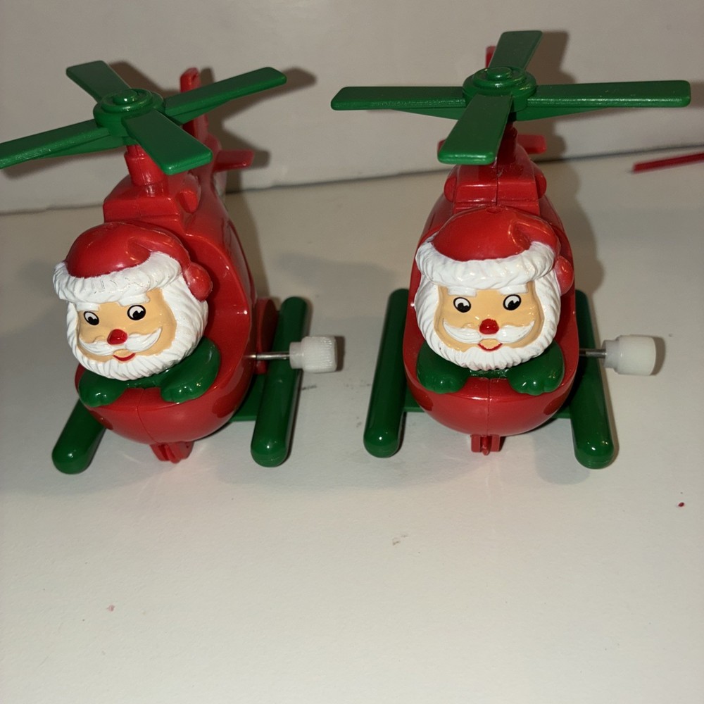 2 Vintage Santa In helicopter Wind Up Toys Plastic works! original Owner