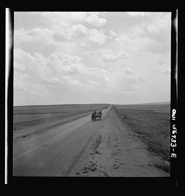 Photo:1930s Horse-Drawn Wagon on Empty Rural Road Prairie Landscape