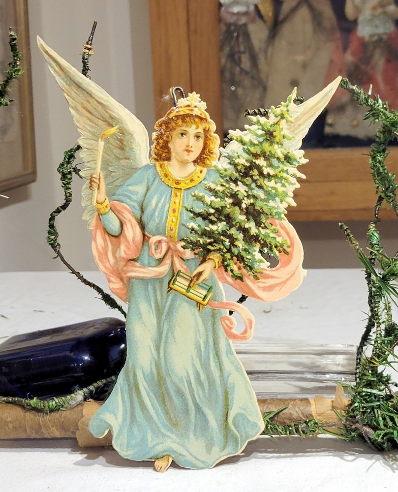 Angel, with Candle delivering Tree, in Night.  Early 1900s German Die-cut Orn