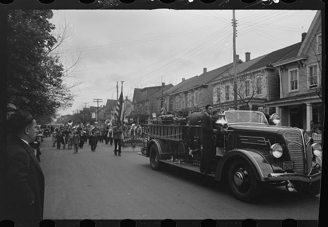 Photo:1930s Firetruck Parade Marching Band Flag Truck Street Scene