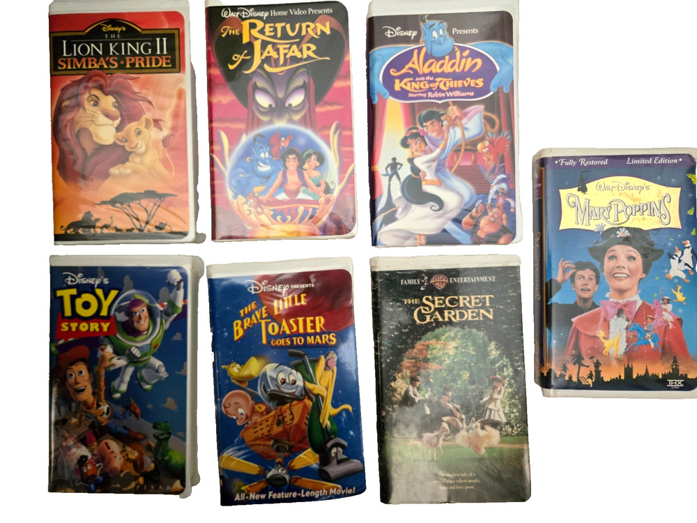 Lot of 7 Vintage Walt Disney VHS Movies Tapes in Clam Shell case -Tested