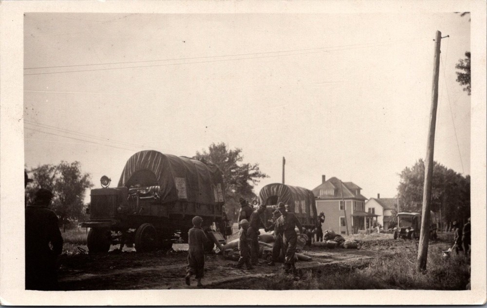 WWII Era Real Photo Postcard Military Trucks Soldiers Civilian Homes RPPC