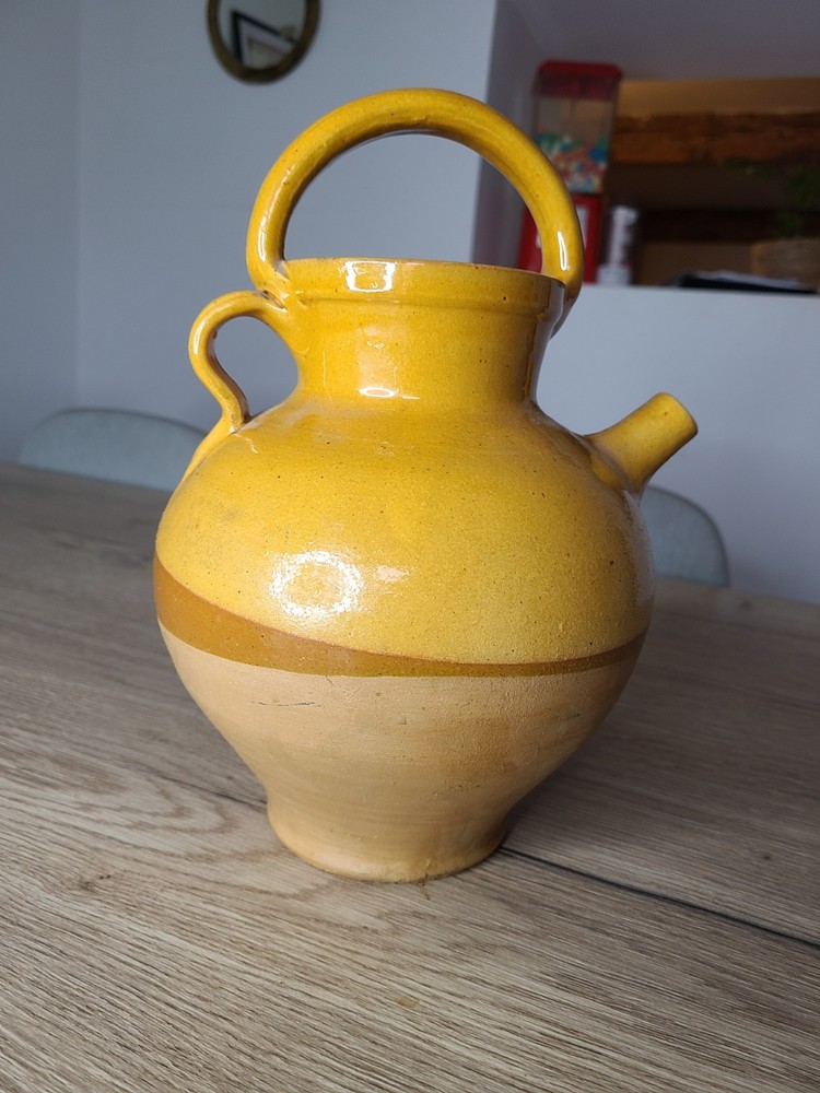 Antique varnished terracotta water jug.