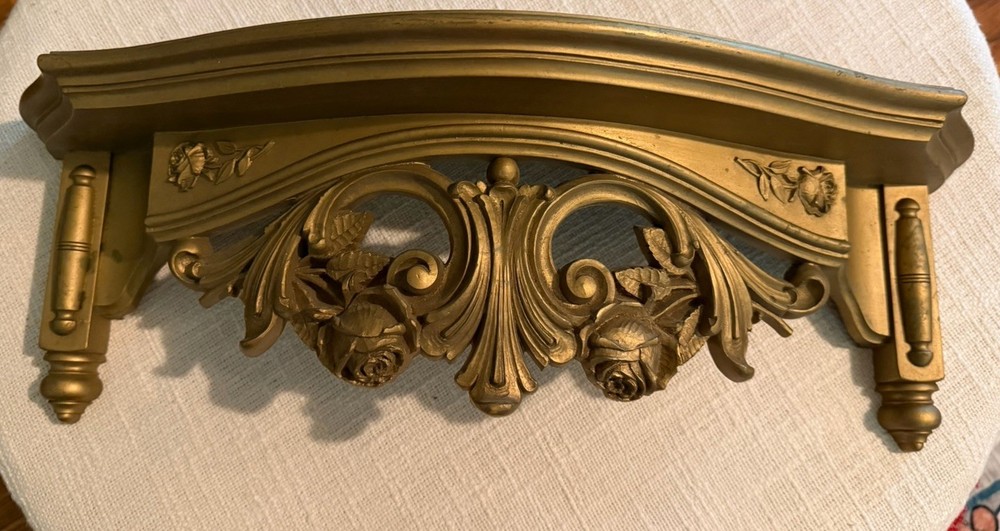 vintage gold-colored wall shelf made by Homco  in a Hollywood Regency style