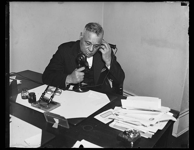 Photo:Unidentified Man at Desk Using Telephone 1940s