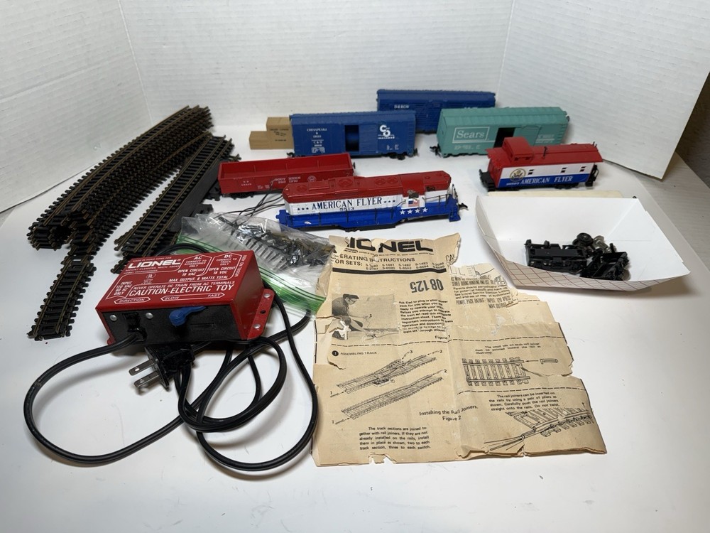 Vintage Lionel & Atlas Train Lot with 7 Misc Trains, 16 Tracks & Accessories
